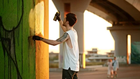 Free Stock Video Young Man Painting A Graffiti With A Spray Live Wallpaper - Free Live Wallpaper