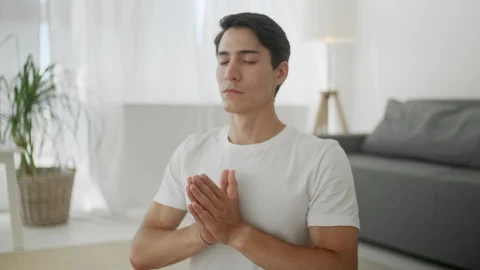 Free Stock Video Young Man Meditating In The Living Room Live Wallpaper - Free Live Wallpaper