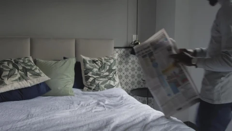 Free Stock Video Young Man Laying On A Bed Reading The Newspaper Live Wallpaper - Free Live Wallpaper