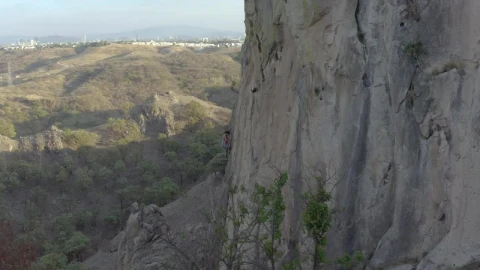 Free Stock Video Young Female Mountaineer Climbing A Large Rocky Mountain Live Wallpaper - Free Live Wallpaper
