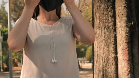 Free Stock Video Young Blonde Woman Putting On A Face Mask Live Wallpaper - Free Live Wallpaper