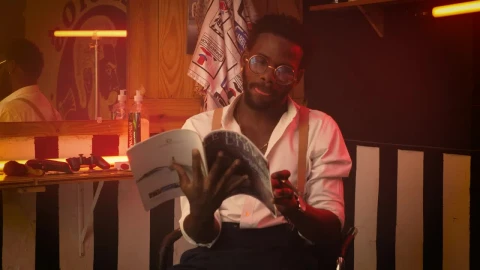 Free Stock Video Young Barber Hanging Out Sitting In His Barbershop Live Wallpaper - Free Live Wallpaper