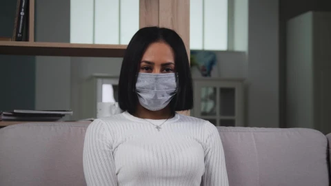Free Stock Video Woman With Medical Face Mask Looking To Camera Live Wallpaper - Free Live Wallpaper