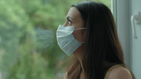 Free Stock Video Woman With Mask Looking Out The Window Live Wallpaper - Free Live Wallpaper