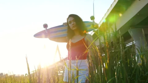 Free Stock Video Woman With A Skateboard Under Sunset Light Live Wallpaper - Free Live Wallpaper