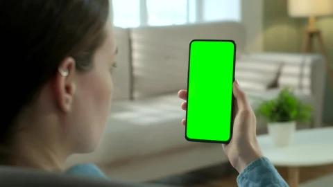 Free Stock Video Woman Watching To A Green Screen Smartphone Live Wallpaper - Free Live Wallpaper