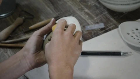 Free Stock Video Woman Using A Wet Sponge On A Clay Object Live Wallpaper - Free Live Wallpaper