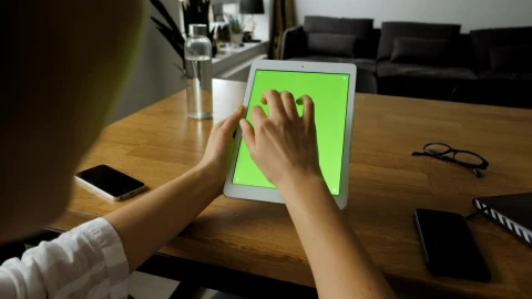Free Stock Video Woman Using A Tablet With A Green Screen Live Wallpaper - Free Live Wallpaper