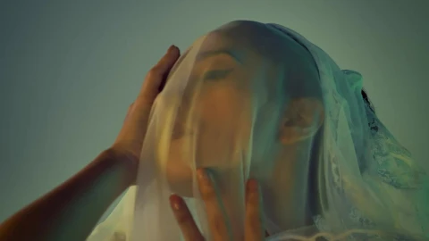 Free Stock Video Woman Touching Her Face Above A Light Veil Live Wallpaper - Free Live Wallpaper