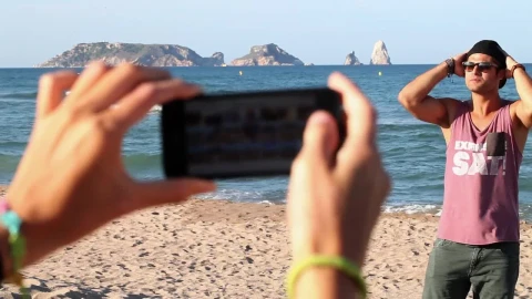 Free Stock Video Woman Taking Photos Of Her Boyfriend On The Beach Live Wallpaper - Free Live Wallpaper