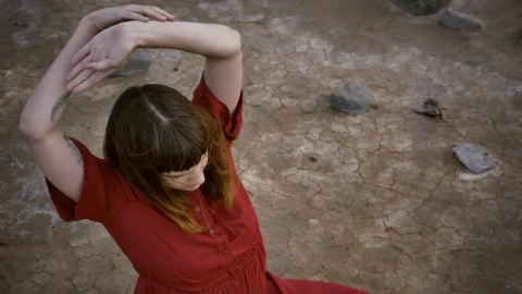 Free Stock Video Woman Stretching Her Body Sitting On The Ground In A Live Wallpaper - Free Live Wallpaper