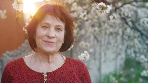 Free Stock Video Woman Smiling At Camera In Front Of A Flowering Tree Live Wallpaper - Free Live Wallpaper