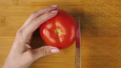 Free Stock Video Woman Slicing Tomato On A Board Live Wallpaper - Free Live Wallpaper