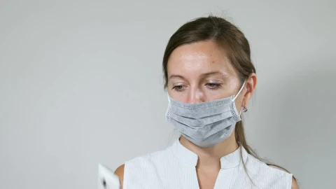 Free Stock Video Woman Sanitizing Her Mobile Phone Live Wallpaper - Free Live Wallpaper