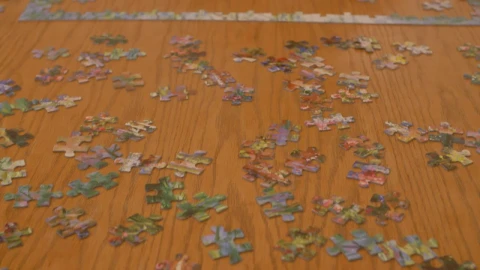 Free Stock Video Woman Putting Together A Puzzle Of Many Pieces Live Wallpaper - Free Live Wallpaper