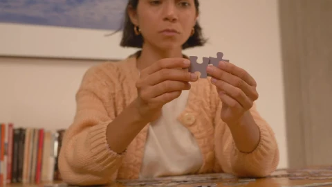 Free Stock Video Woman Putting Puzzle Pieces Together Live Wallpaper - Free Live Wallpaper