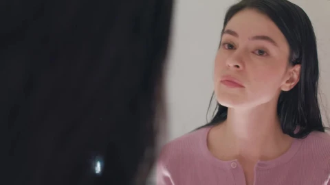 Free Stock Video Woman Putting On Her Earrings In Front Of The Mirror Live Wallpaper - Free Live Wallpaper