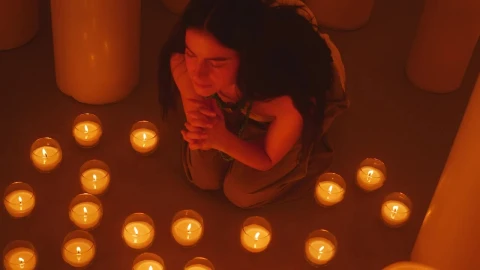 Free Stock Video Woman Praying Sitting On The Floor Among Many Candles Live Wallpaper - Free Live Wallpaper