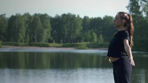 Free Stock Video Woman Practicing Breathing Exercises By The Lake Live Wallpaper - Free Live Wallpaper