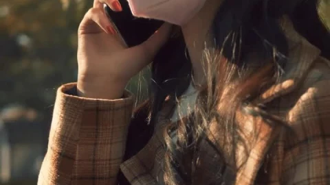 Free Stock Video Woman On The Phone Wearing Mask Live Wallpaper - Free Live Wallpaper