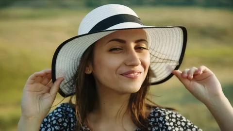 Free Stock Video Woman Holding Her Hat In A Meadow Live Wallpaper - Free Live Wallpaper
