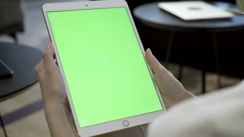 Free Stock Video Woman Holding A Tablet With A Chroma Key Screen Live Wallpaper - Free Live Wallpaper