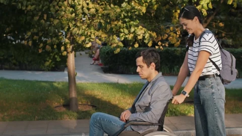Free Stock Video Woman Helps Man In Wheelchair On The Street Live Wallpaper - Free Live Wallpaper
