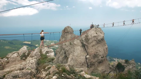 Free Stock Video Woman Crossing A Suspension Bridge In The Mountains Live Wallpaper - Free Live Wallpaper