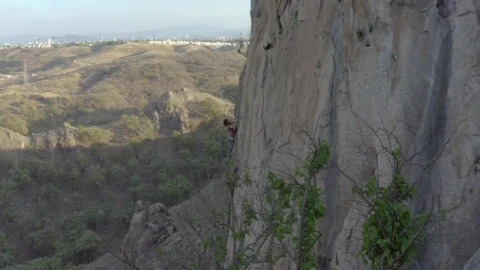 Free Stock Video Woman Climbing A Vertical Rocky Of A Large Mountain Live Wallpaper - Free Live Wallpaper