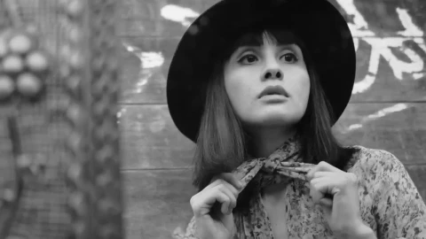 Free Stock Video Woman Adjusting Her Neck Scarf In Black And White Live Wallpaper - Free Live Wallpaper