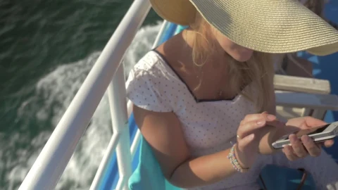 Stock Footage Woman Checking Her Phone While On A Boat Live Wallpaper - Free Live Wallpaper