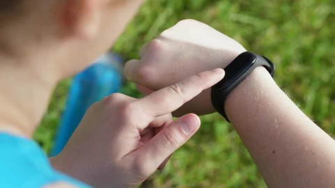 Stock Footage Woman Checking Her Fitness Gadget Live Wallpaper - Free Live Wallpaper