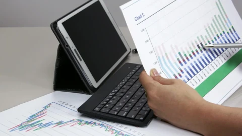 Stock Footage Woman Checking A Graph At Work Live Wallpaper - Free Live Wallpaper