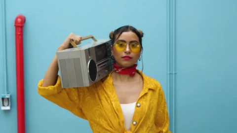 Stock Footage Woman Carrying A Retro Boombox On Her Shoulder Live Wallpaper - Free Live Wallpaper