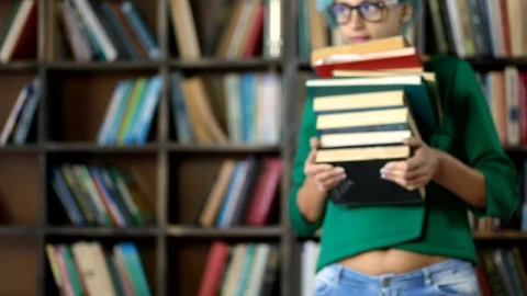 Stock Footage Woman Carrying A Lot Of Books Live Wallpaper - Free Live Wallpaper