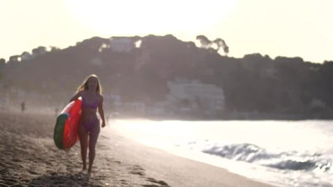 Stock Footage Woman Carrying A Beach Inflatable Live Wallpaper - Free Live Wallpaper