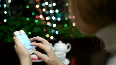 Stock Footage Woman Browsing Photos In A Cafe Live Wallpaper - Free Live Wallpaper