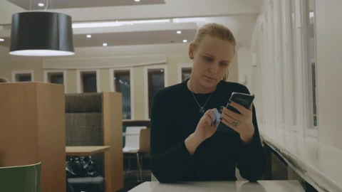 Stock Footage Woman Browsing Her Phone In A Hotel Live Wallpaper - Free Live Wallpaper