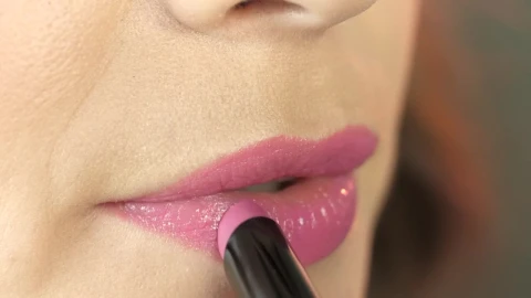Stock Footage Woman Applying Pink Lipstick Live Wallpaper - Free Live Wallpaper