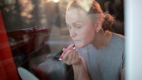 Stock Footage Woman Applying Pink Lip Gloss Live Wallpaper - Free Live Wallpaper