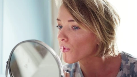 Stock Footage Woman Applying Lipstick Live Wallpaper - Free Live Wallpaper