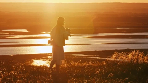 Stock Footage Woman And Her Baby Spinning At Sunset Live Wallpaper - Free Live Wallpaper