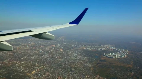 Stock Footage Wing View Of An Airplane Flying Above The City Live Wallpaper - Free Live Wallpaper