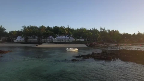 Stock Footage White Boat Anchored By A Small Beach Live Wallpaper - Free Live Wallpaper