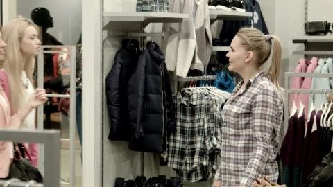 Stock Footage Welcoming Customers In Clothing Shop Live Wallpaper - Free Live Wallpaper