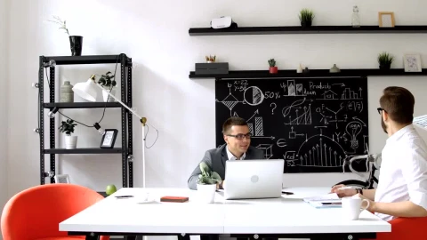Stock Footage Web Design Team Look At Prototype In Modern Office Live Wallpaper - Free Live Wallpaper