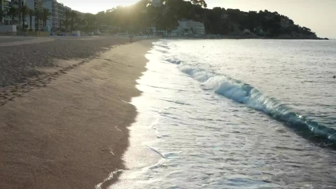 Stock Footage Waves Breaking By A Coastal Town Live Wallpaper - Free Live Wallpaper