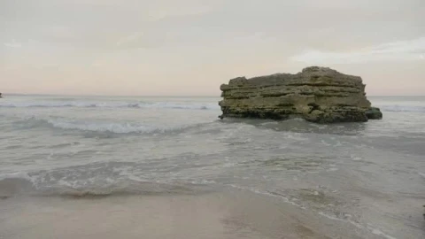 Stock Footage Waves Breaking Against A Large Rock Smalllive Wallpaper - Free Live Wallpaper