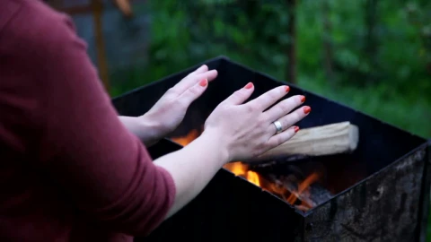 Stock Footage Warming Her Hands Over A Fire Live Wallpaper - Free Live Wallpaper