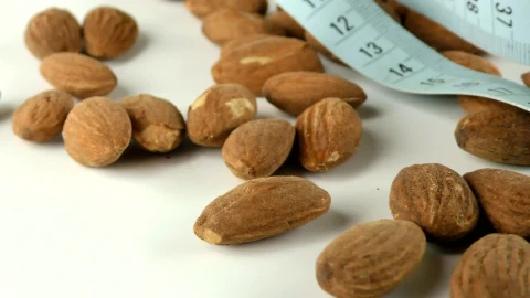 Stock Footage Walnuts And A Blue Measuring Tape Live Wallpaper - Free Live Wallpaper